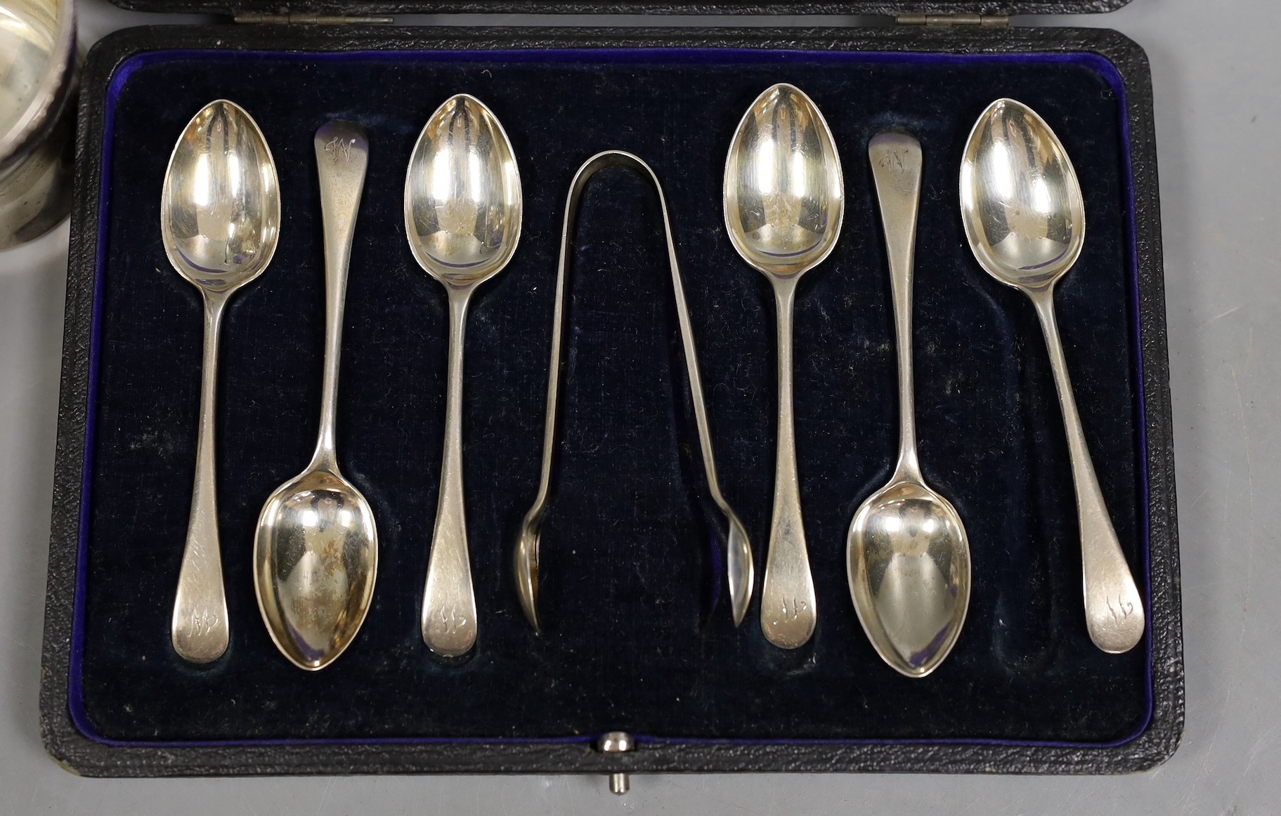 A Siamese sterling two handled ice pail with tongs, height 12.5cm, together with a cased set of six teaspoons with tongs, a silver compact a silver Vogel travelling timepiece on albert chain, three silver condiments, two